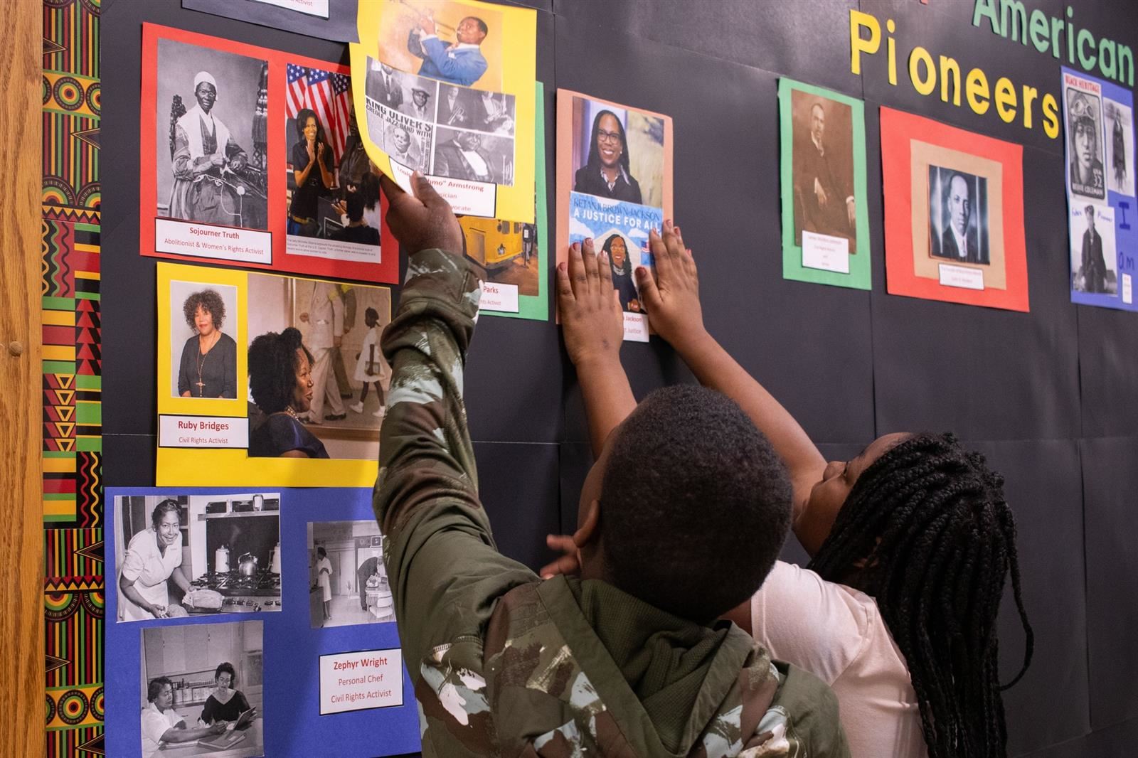  students place photos on Black History Month wall 